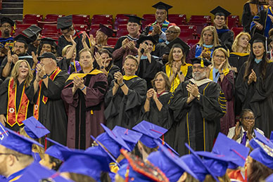 Faculty members applaud graduates
