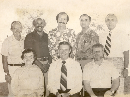 Administration, 1970's. Front, from left: Jinette Kirk; Theo Heap; Keyworth. Back row, from left: Hurlebaus; Wright; Gilanardo; Owens; Johansen