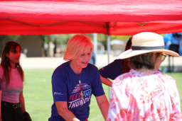 Dawn Zimmer volunteering at tent at the birthday celebration
