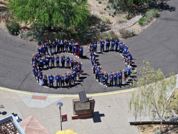 Aerial photo of MCC employees in the shape of 60