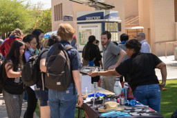 Students gathering at tables during the birthday party celebration 