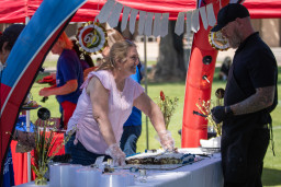 Cheryl Patton serving birthday cake to a guest