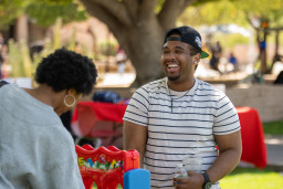 Man laughing while attending birthday celebration