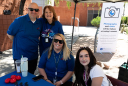 4 people at a booth at the Red Mountain Campus