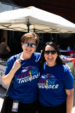 Marcy Snitzer and Amanda Hausman smiling at birthday party celebration