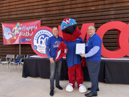 Thor with MCC President Richard Daniel holding proclamation