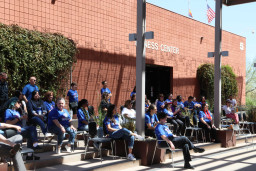 Guests sitting in chairs during program at MCC Red Mountain birthday celebration