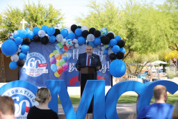 MCC president Richard Daniel speaking at podium during birthday celebration