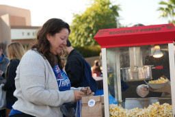 MCC Employee Liz Murphy standing at popcorn machine