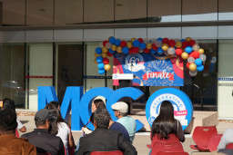 Large MCC letters in front of stage at the Art Gallery