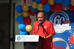 MCC Cross County coach, Daniel Pescador, speaking at the podium