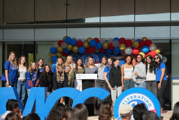 Group photo of MCC'v volleyball team and coach