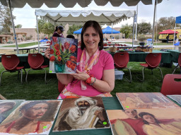 Student holding painting