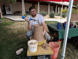 Student with pottery wheel