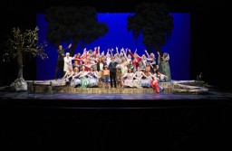 Cast members in theatre production