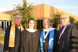 4 MCC faculty members standing by each other at MCC's graduation ceremony