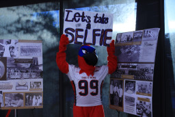 Thor holding a sign that reads "Let's take a selfie"