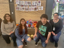 Students in front of Día de los Muertos display