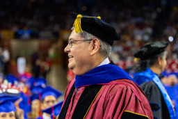 Dr. Richard Daniel marching in MCC's commencement