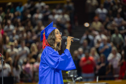 MCC student singing National Anthem at graduation