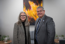 House of Representative Janeen Connolly standing with MCC President Dr. Daniel