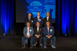 The 2022 class of inductees to the MCC Hall of Fame gather for a group photo.