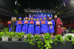 MCC's first ever bachelor degree graduates on stage at MCC's 2025 ceremony