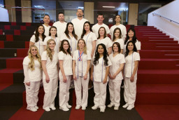 Students in white uniforms at 2015 Nurses Pinning ceremony