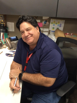 Psychology residential faculty, Robert Keone sitting at a desk