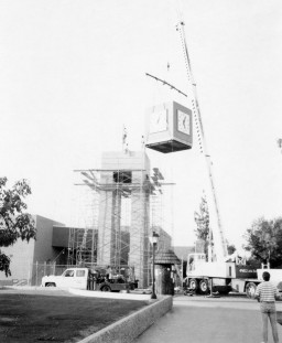 Crane lifts clockworks to the top of the tower, Southern & Dobson Campus