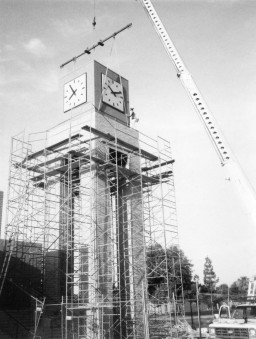 Clockworks are put in place on top of the tower, Southern & Dobson Campus