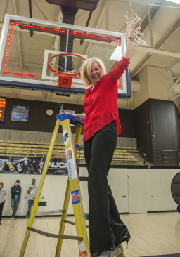 Coach Kori Stephenson cutting the net after MCC's National Championship victory