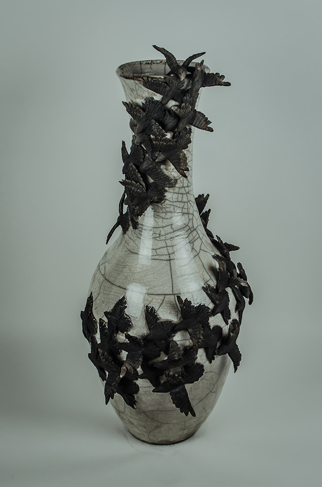 Ceramic vase with black crows.