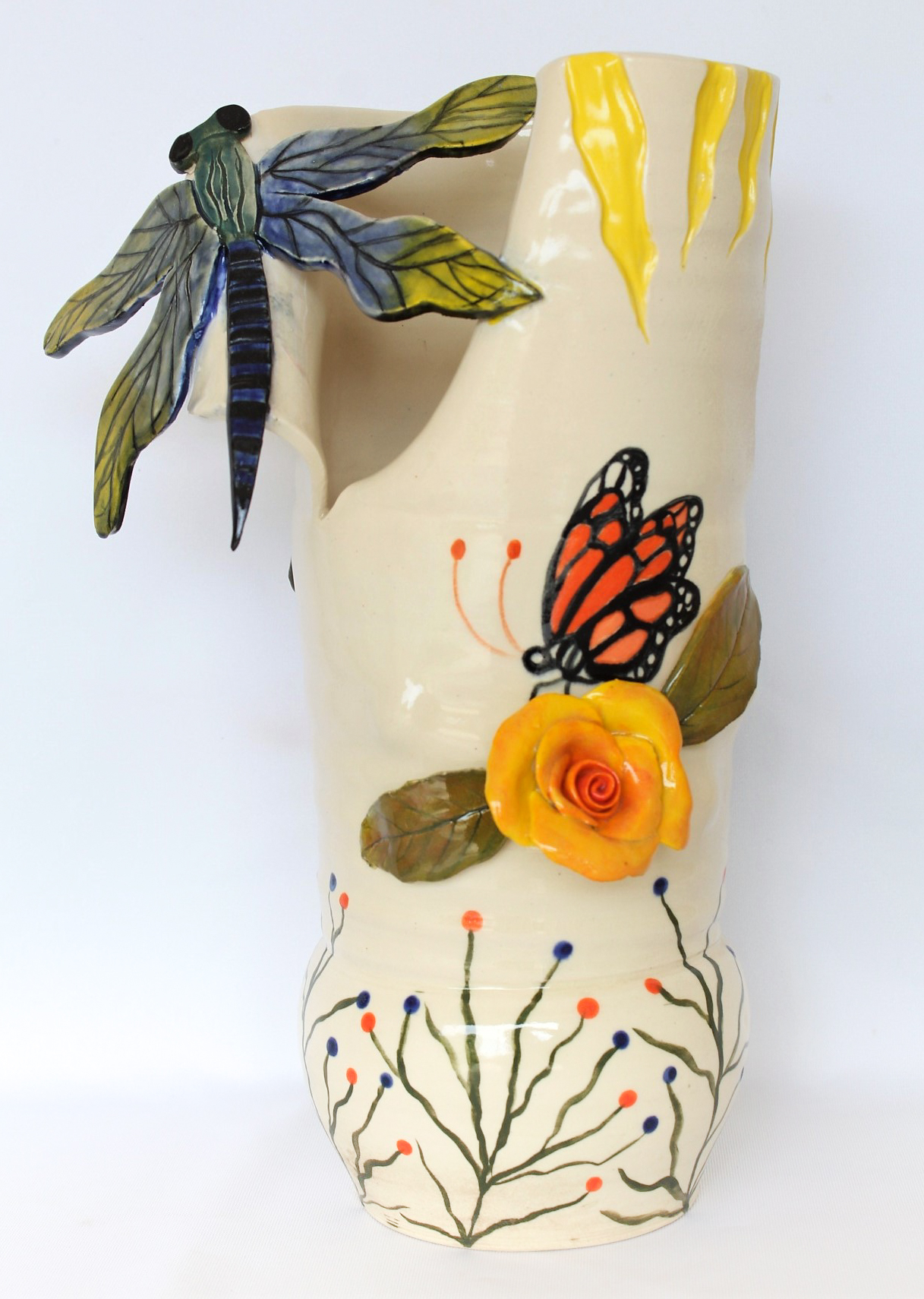 Ceramic vase with insects, flowers and fruit.