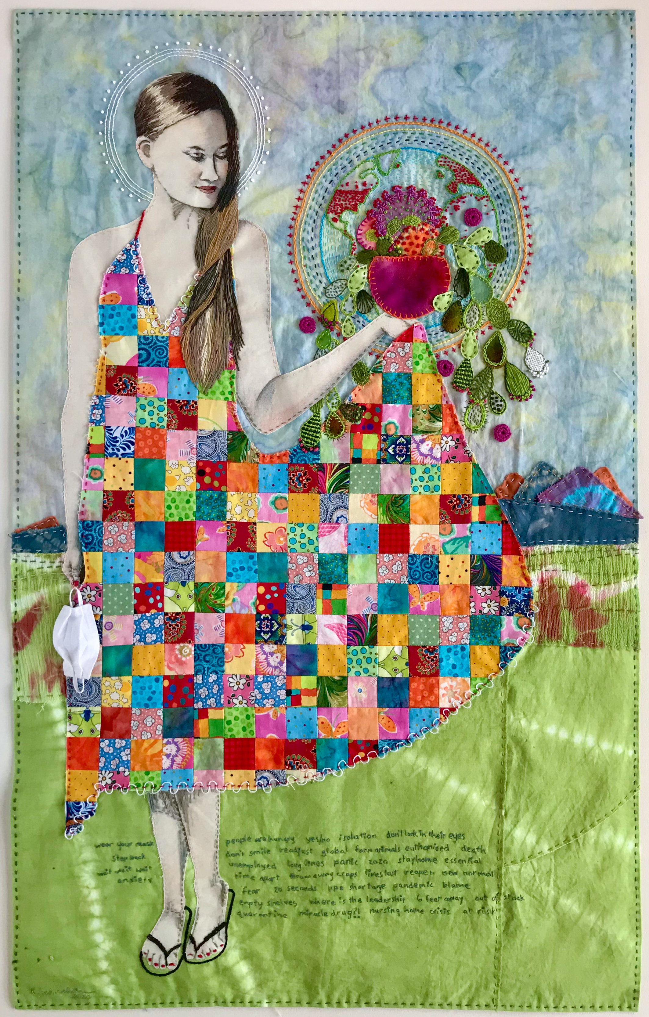 Fiber art of a figure in a patchwork dress.