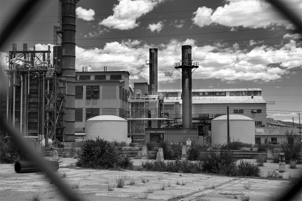 A black and white photograph of a factory in New Mexico.