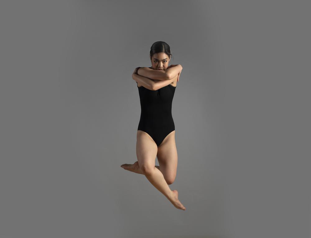 Photograph of a dancer in mid-air.