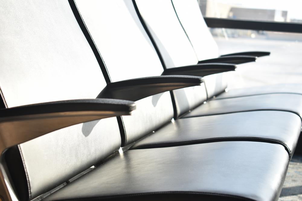 Photograph of chairs in an airport terminal.