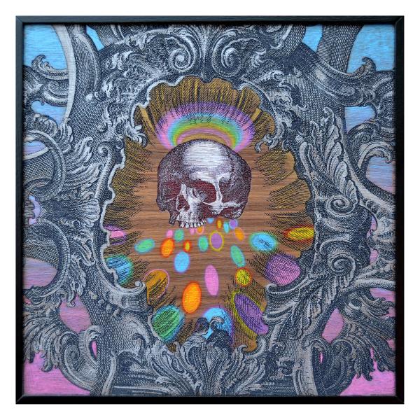 A mixed media artwork with a skull in the center and a baroque frame.