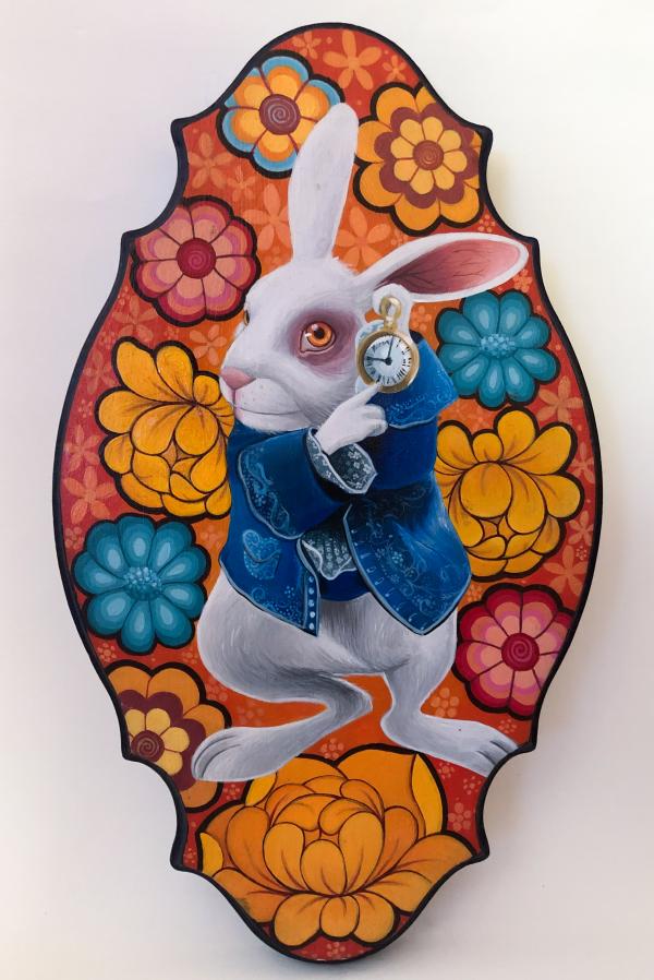 Painting of a rabbit holding a pocket watch on a board with a graphic, floral background.