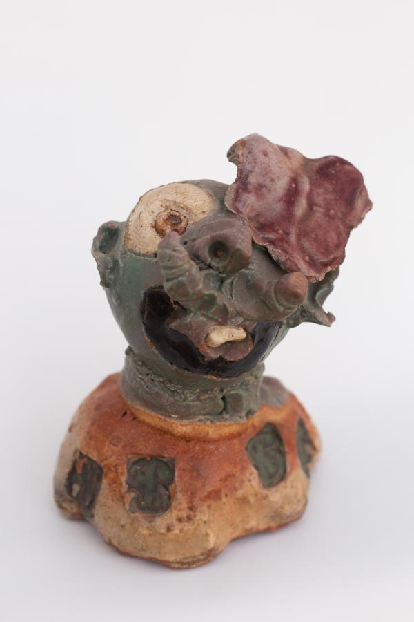 A sculpture of a ceramic head.