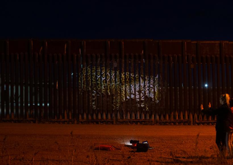 Strohacker's projection "Unfragmenting/Des Fragmentando" on the US Mexico Border Fence