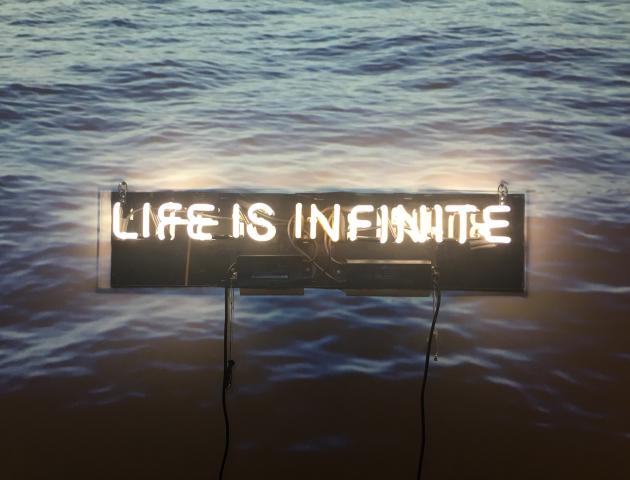 Still from video and neon installation "Life is (In)finite" by Ronna Nemitz
