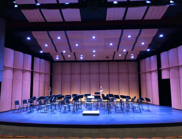Performing arts center stage with music stands