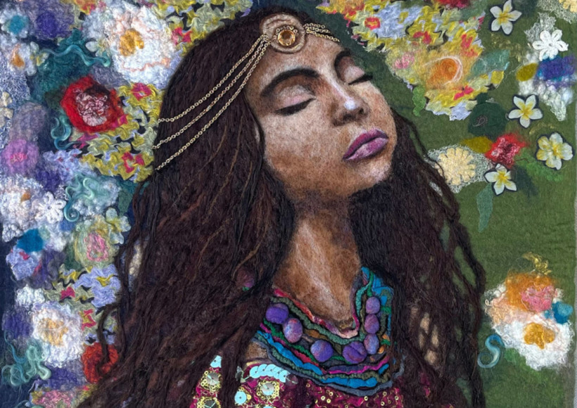 Image of woman with closed eyes surrounded by flowers