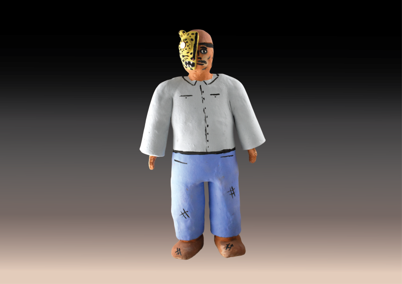 painted ceramic sculpture of man wearing jaguar mask on half his face