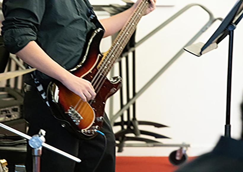 Closeup of an electric guitar.