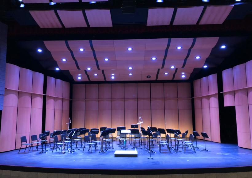 Performing arts center stage with music stands