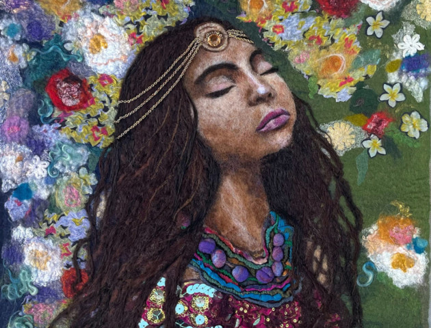 Image of woman with closed eyes surrounded by flowers