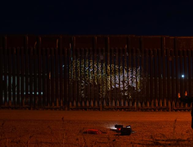Strohacker's projection "Unfragmenting/Des Fragmentando" on the US Mexico Border Fence